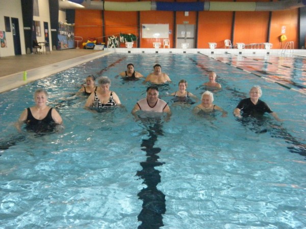Group of older people doing aqua aerobics