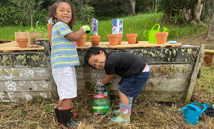 kids playing with gardening gear