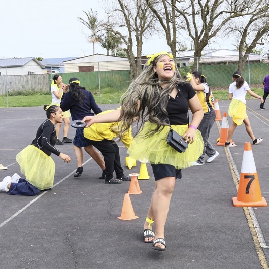 Young people laughing during a school activity image