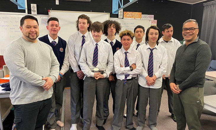 A group of students with their teacher in a classroom