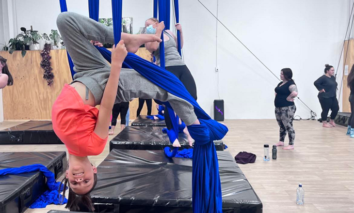 young women doing silks