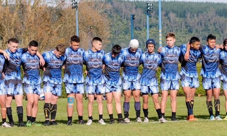 Rangitahi rugby team standing together on the field