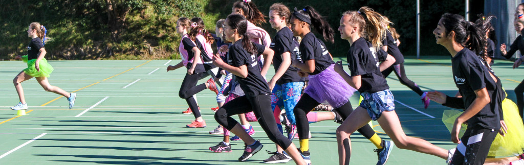 young netball players doing running drills