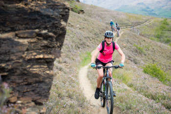 A young woman cycling in the outdoors