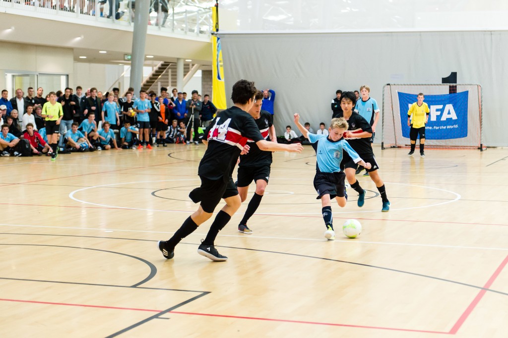 Teenage boys playing futsal