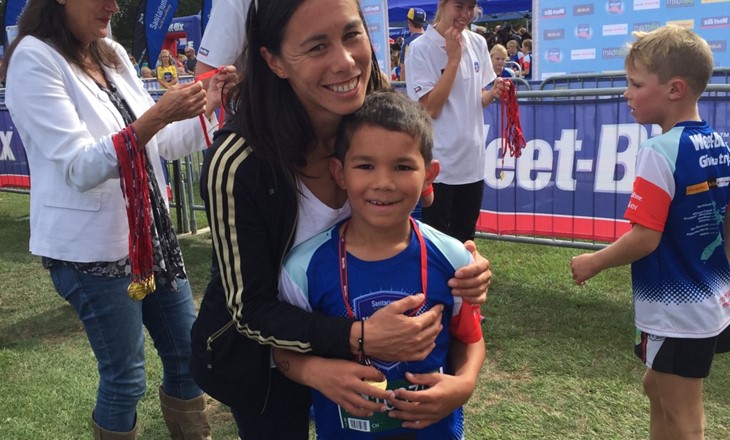 Andrea Hewitt and child at an event