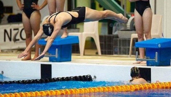 Kayla Imrie diving into a pool