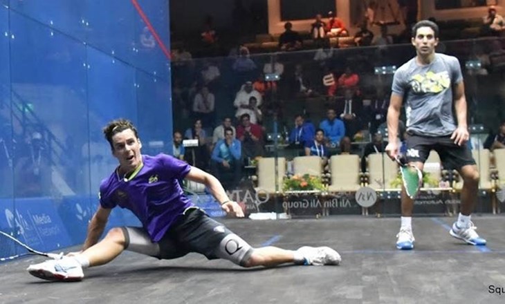 Paul Coll does the splits while playing squash