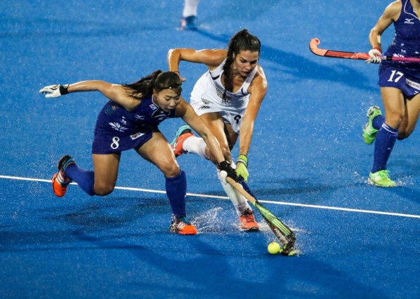 Vantage Black Sticks Women vs Japan two players tackling for the ball