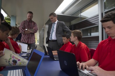 Prime minister in a classroom with kids on their laptops