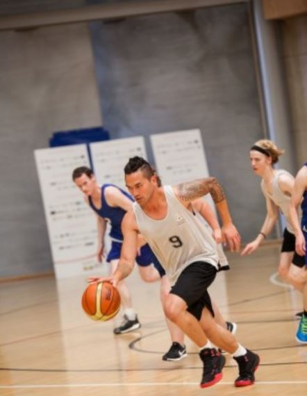 team playing basketball looking very focused