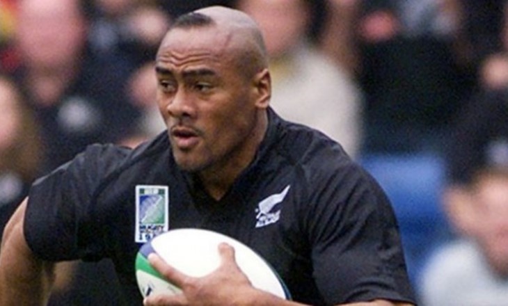 Jonah Lomu with a rugby ball in his hands