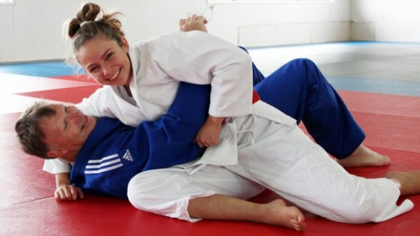 A player and her coach practicing Judo