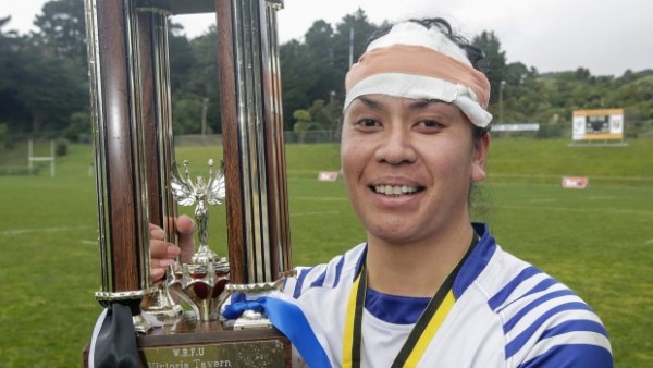 Player holding up a trophy