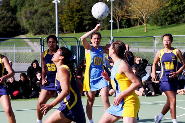 Young women playing netball