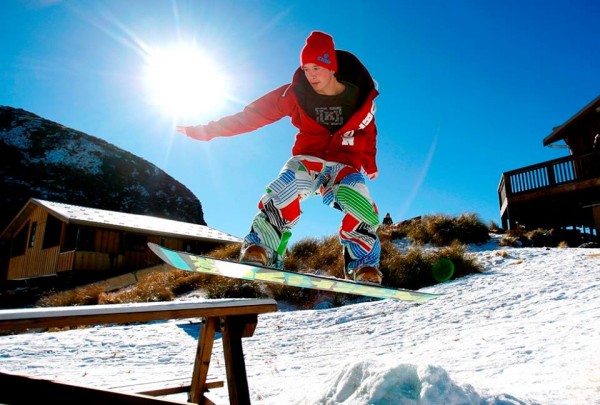 Young man doing tricks on a snowboard