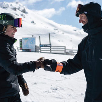 Zoi and coach fist bumping