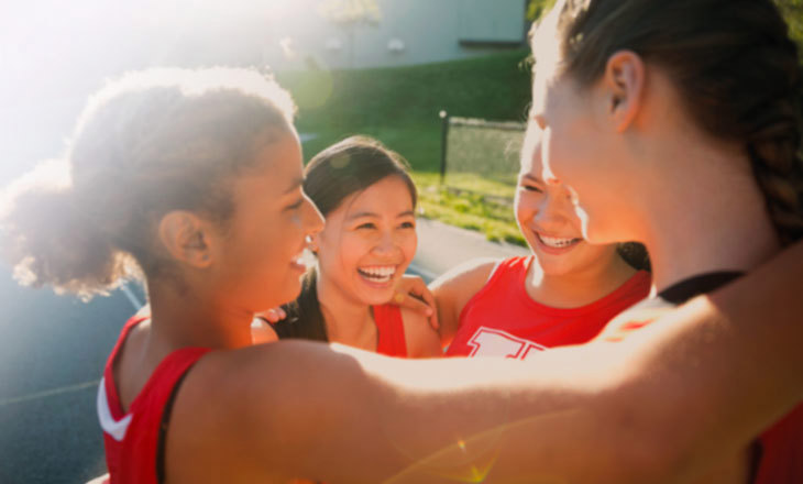 Four girls huddling