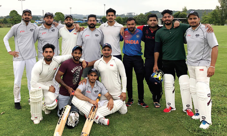 Cricketers pose for a team shot