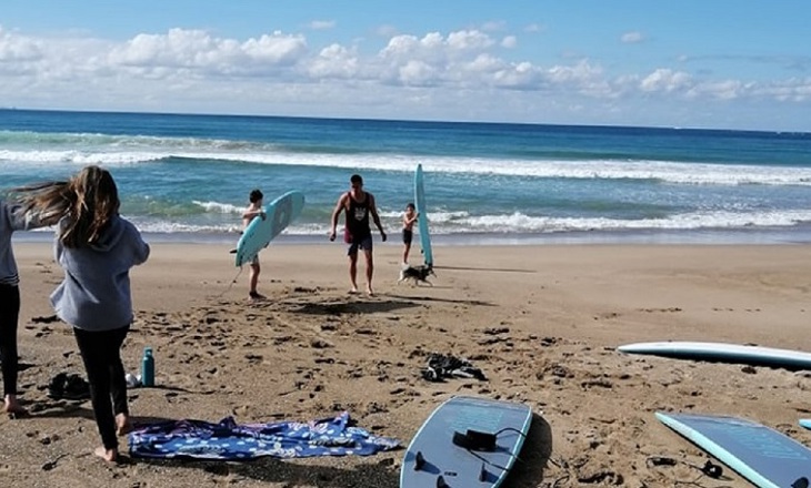 young people out surfing