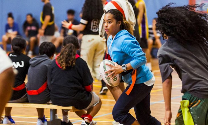 Rangitahi runs with rugby ball during an indoor game