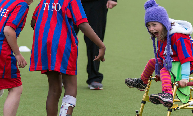 Excited tamariki on a football field