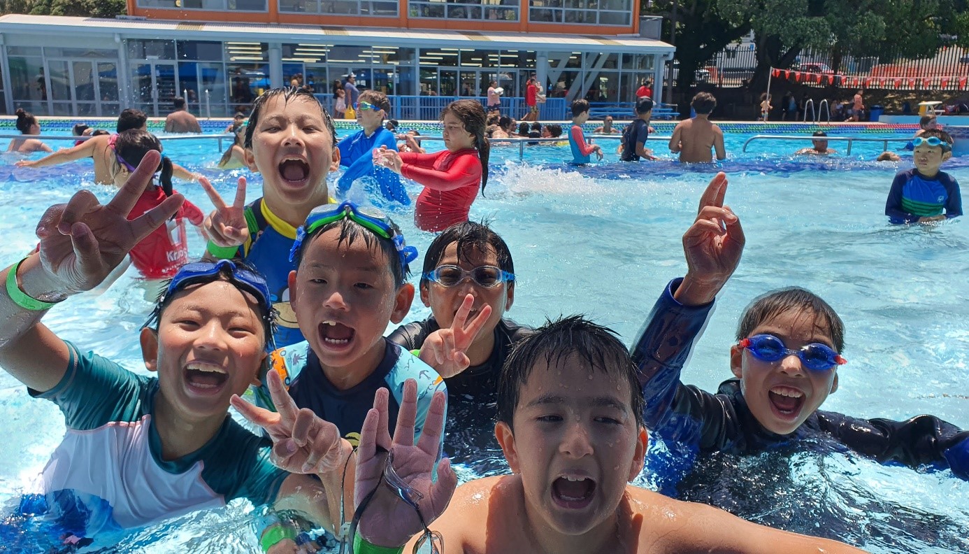 Group of young people having fun in a pool