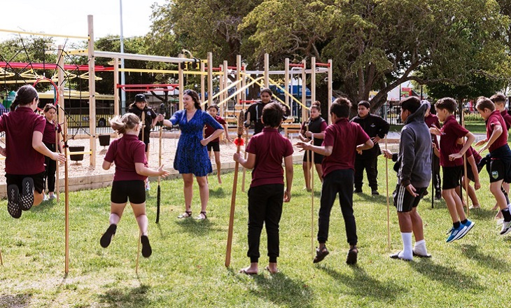 Group of students in standing by a playground