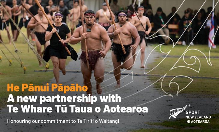 Māori on a path with traditional weaponry