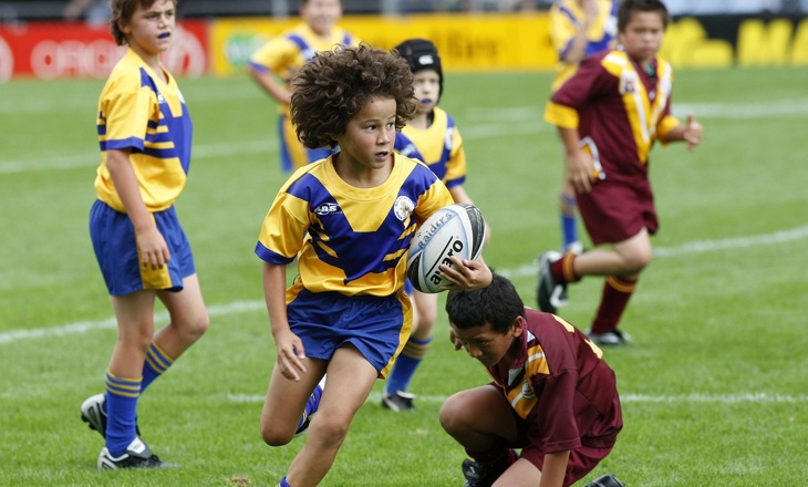 Tamariki playing rugby