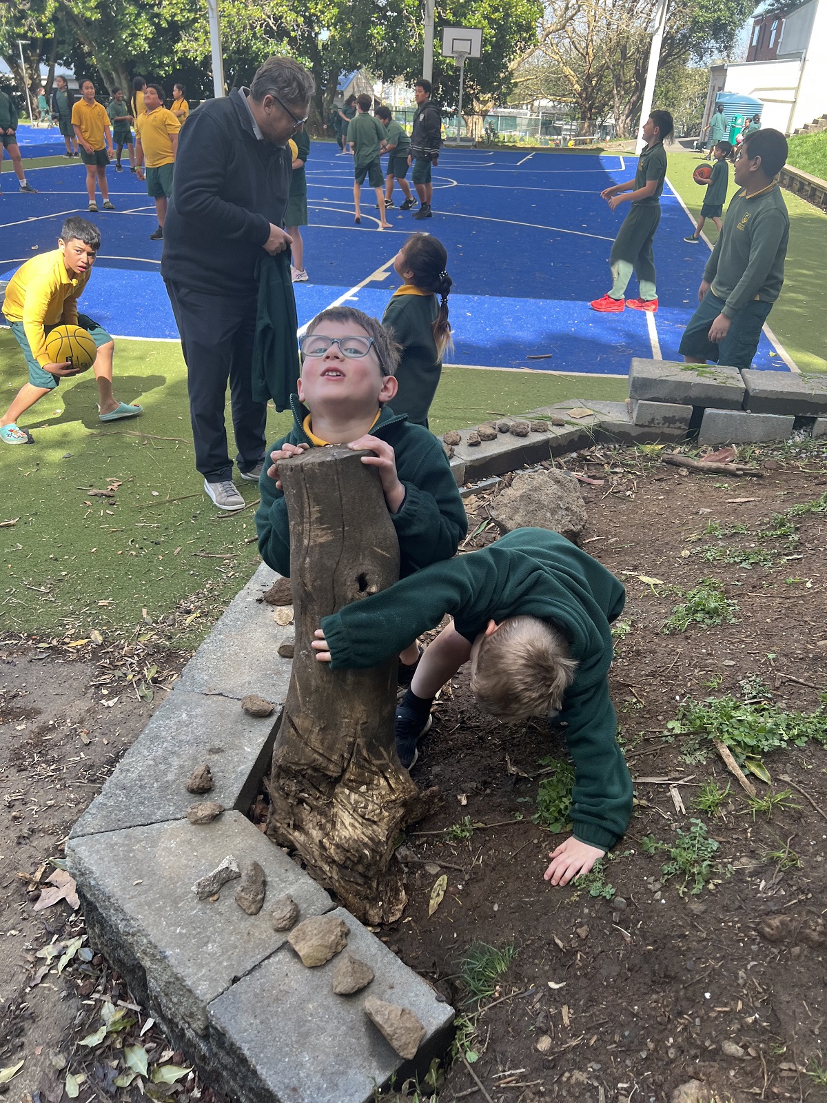 Tamariki playing in mud