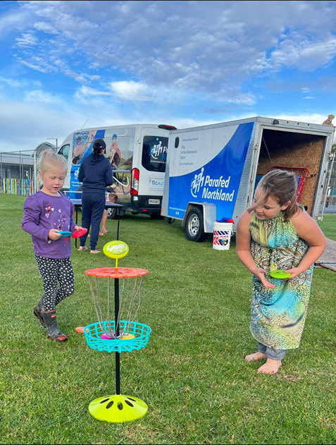 Tamariki playing mini frisbee games