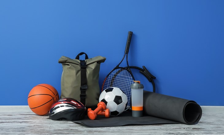 Group of sports equipment against a blue background