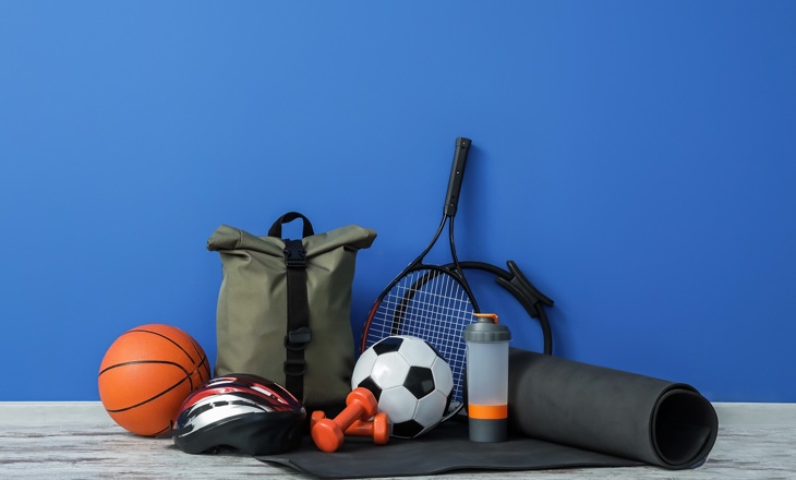 Group of sports equipment against a blue background