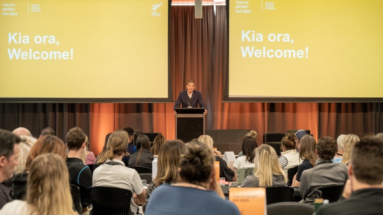 A person talking at the Youth Sport Hui 2023