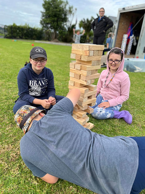 Tamariki playing giant jenga