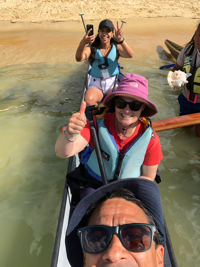 Three people smiling for photo in waka