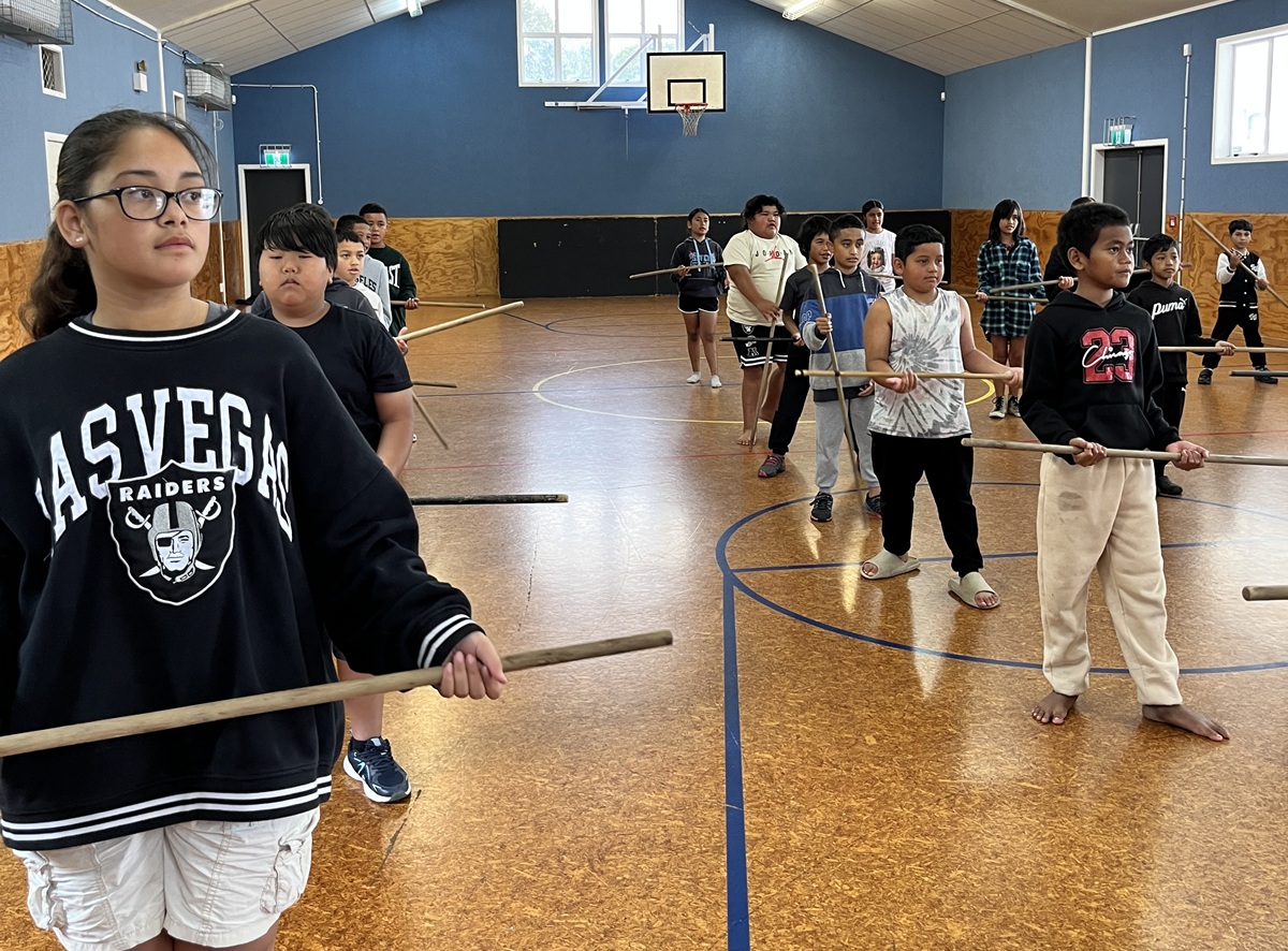 School group practicing in a hall