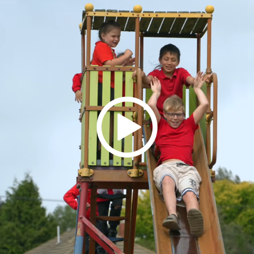 Tamariki going down a slide