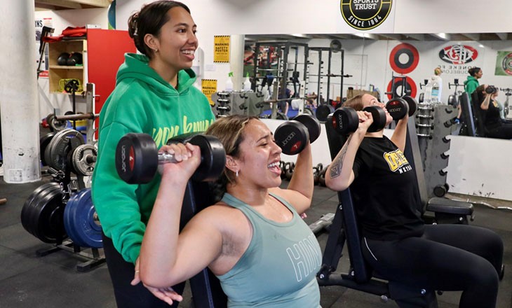 Three wahine during a Toitū Pōneke Community and Sports Centre workout session