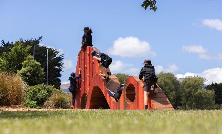 Tamariki on a wooden structure