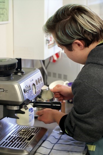 School staff support ākonga to learn practical life skills: from shopping the day before, to food preparation, to making coffees on the barista coffee machine.