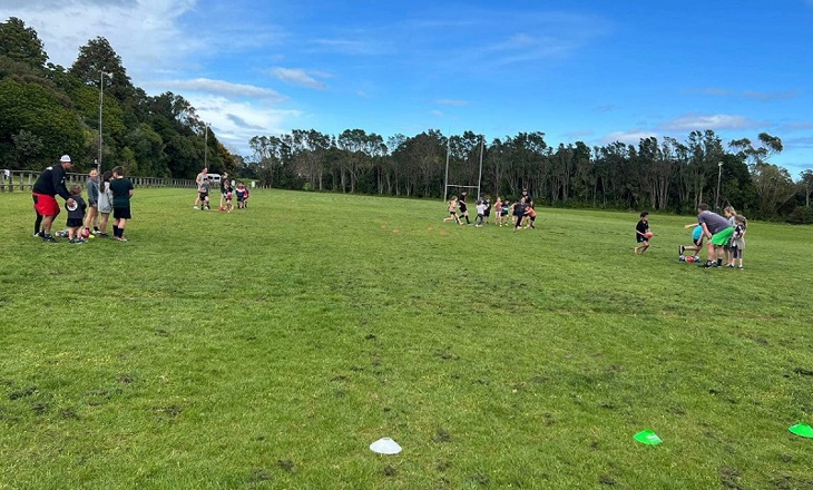 Four groups of people playing outdoors