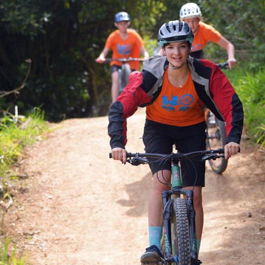 Young women riding a bike image