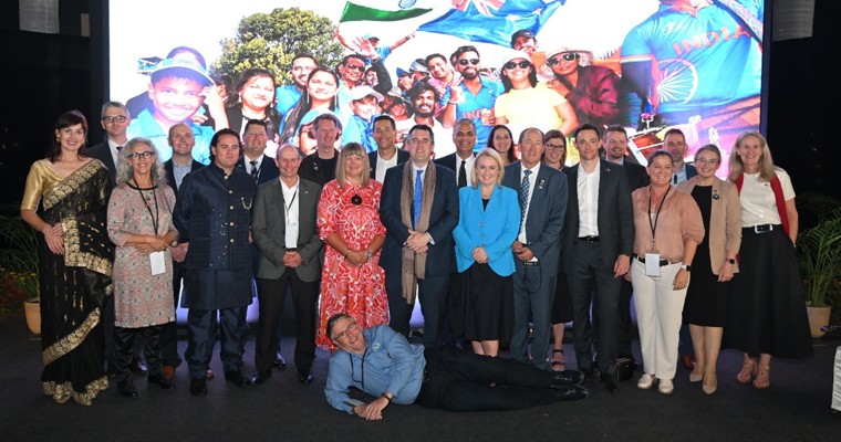 People standing in front of a banner