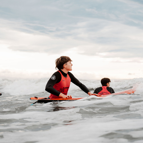 Rangatahi on a surfboard
