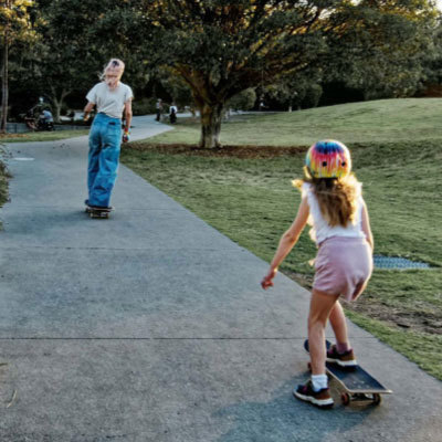 Mother and daughter on skateboards