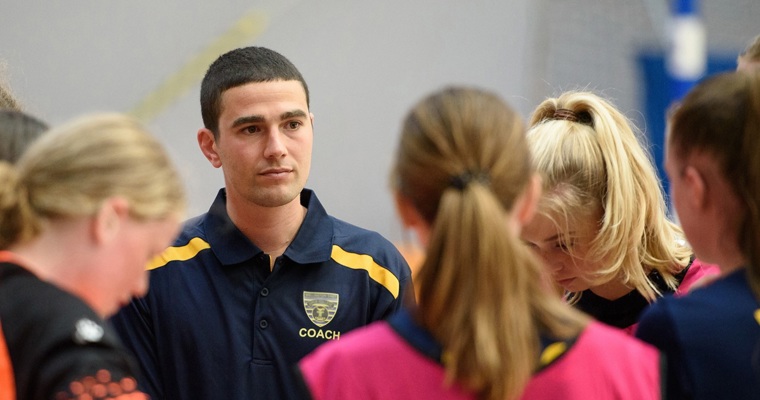 Team talking to their coach