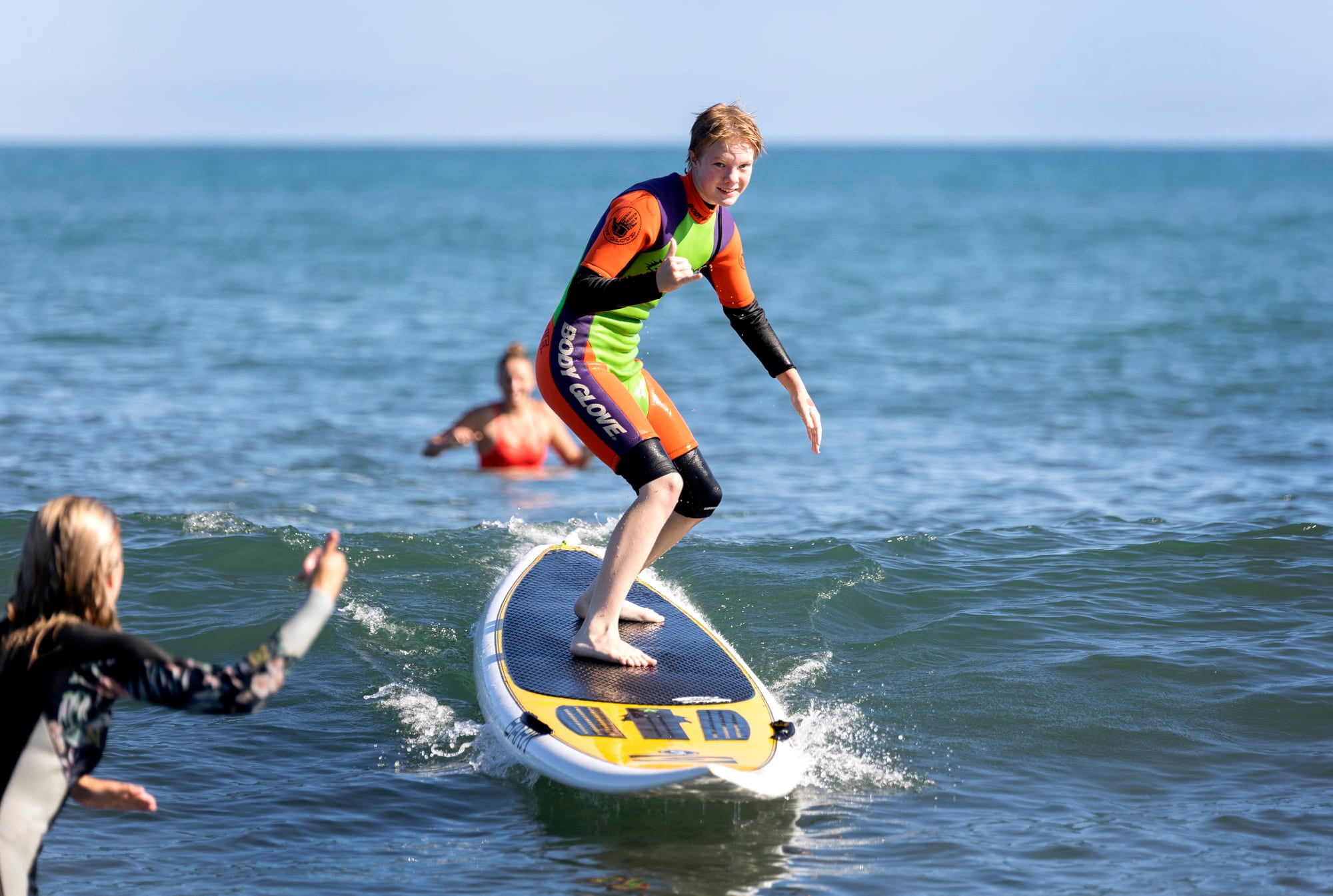 Rangatahi on a surfboard