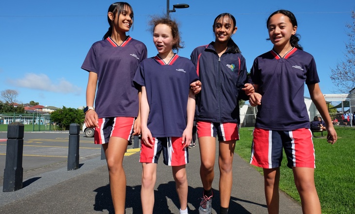 Group of young women walking outside for a PE class